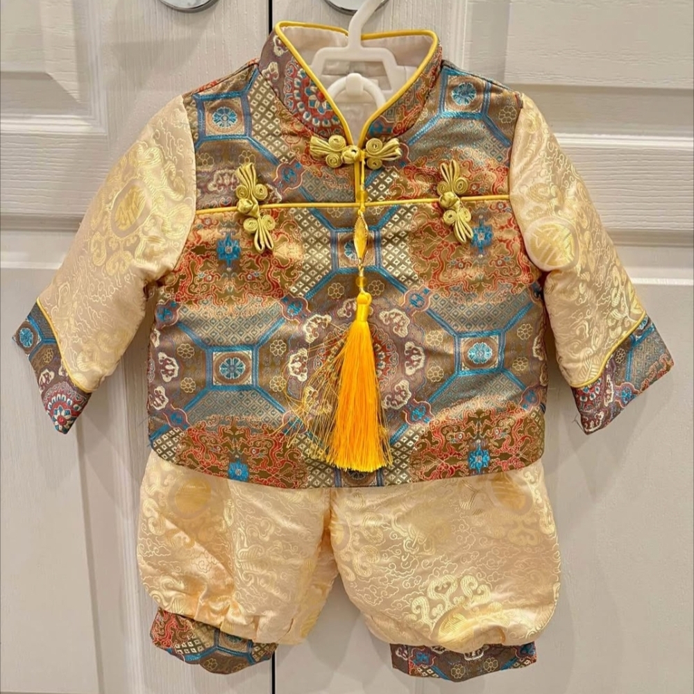 Traditional Baby Outfit with Intricate Patterns